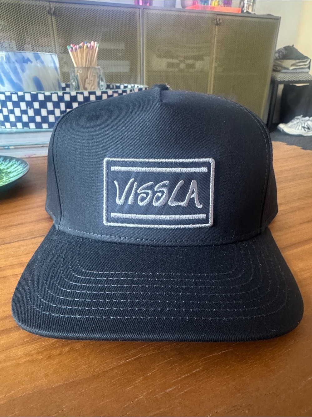VISSLA Black Snapback with White Embroidered Logo